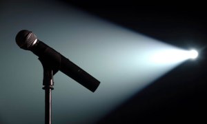 Spot lit microphone and stand on an empty stage